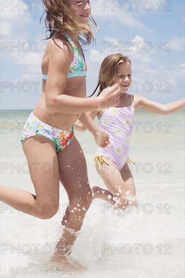 Girls running in ocean. Date : 2008