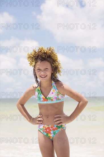 Girl posing with seaweed on head. Date : 2008