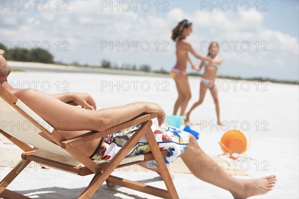 Family vacationing at beach. Date : 2008