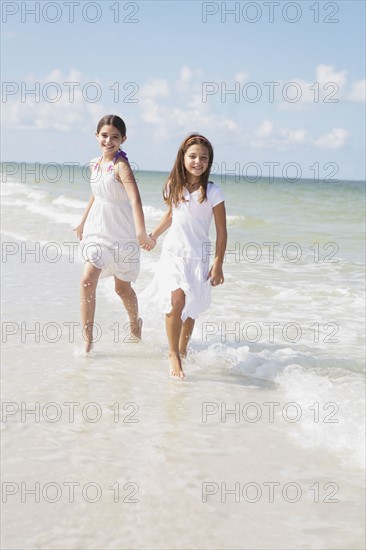 Girls running in ocean. Date : 2008