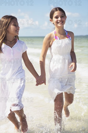 Girls running in ocean. Date : 2008