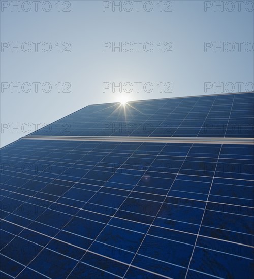 Sun shining on solar panel.