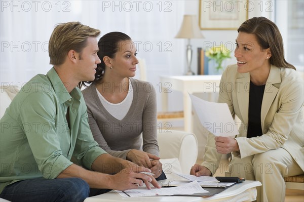 Couple meeting with financial advisor.