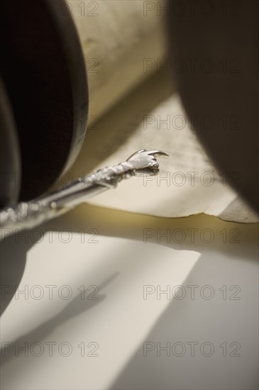 Pointer pointing to Torah scroll.