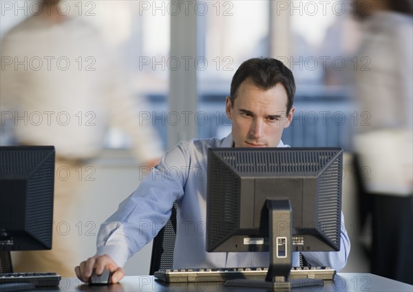 Businessman working at computer.