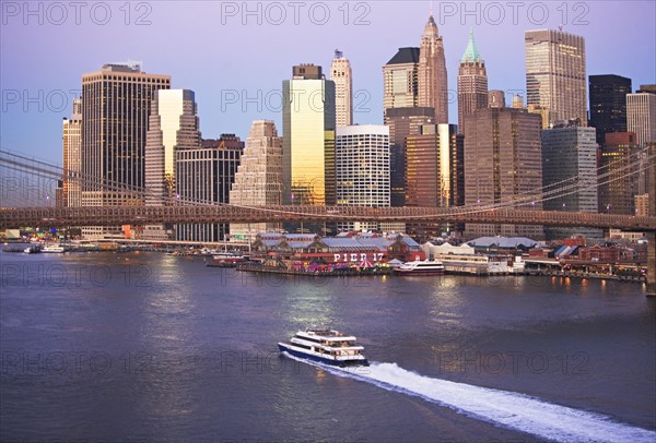 Boat passing under Brooklyn Bridge. Date: 2008