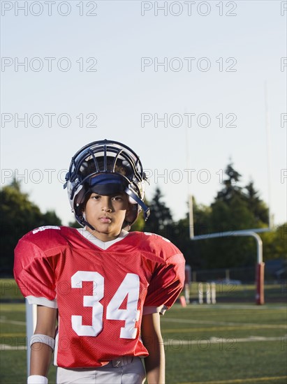 Football player standing on field and looking serious. Date: 2008
