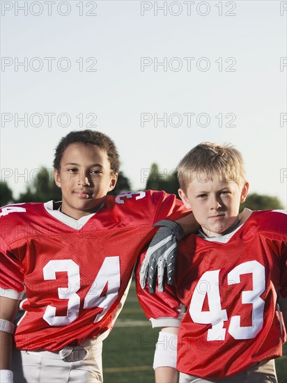 Football players posing on field. Date: 2008
