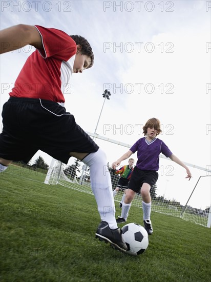 Boys playing competitive soccer. Date: 2008