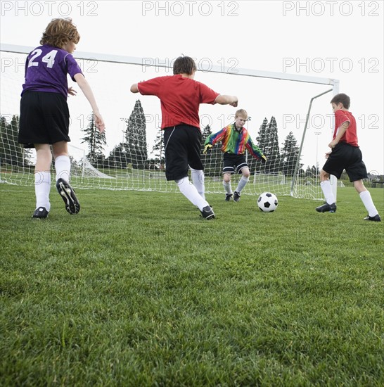 Boys playing competitive soccer. Date : 2008