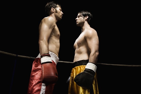 Boxers facing off in boxing ring. Date : 2008