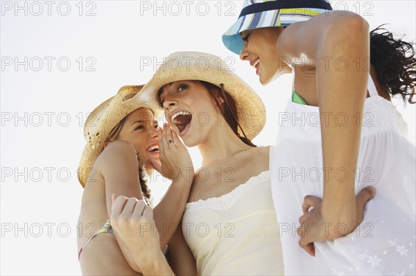 Young women whispering. Date: 2008