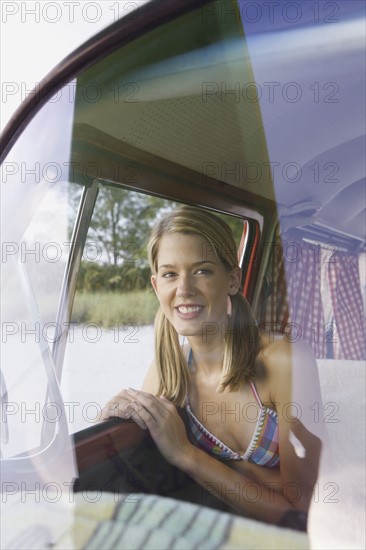 Woman sitting in passenger seat of van. Date : 2008