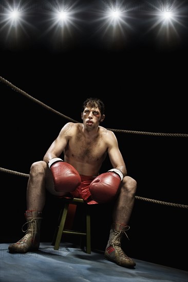 Boxer sitting on stool in corner of boxing ring. Date : 2008