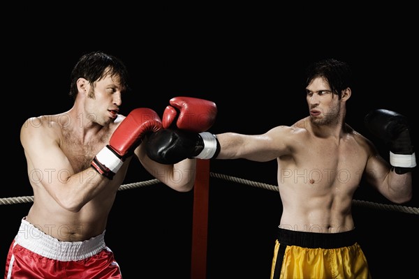 Boxers fighting in boxing ring. Date : 2008