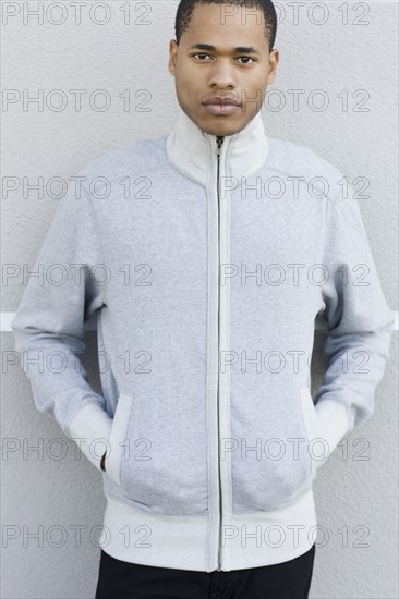 Portrait of young man leaning against wall. Date : 2008