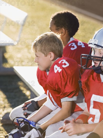 Football players sitting on bench. Date : 2008