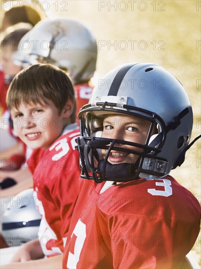 Football players sitting on bench. Date : 2008