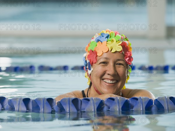 Woman in swim cap posing in swimming pool. Date : 2008