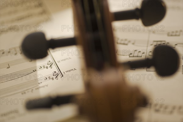 Close up of violin bow on sheet music.