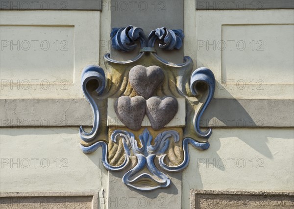 Close up of heart emblem on house.