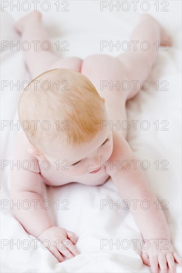 Naked baby laying on blanket. Date : 2008