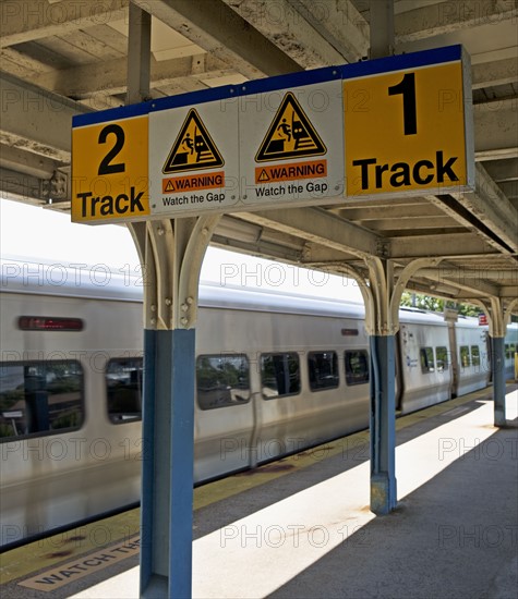 Commuter train arriving at station platform. Date : 2008