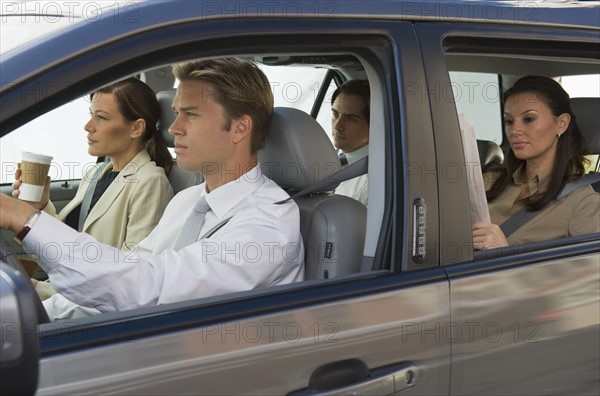 Business people car pooling.