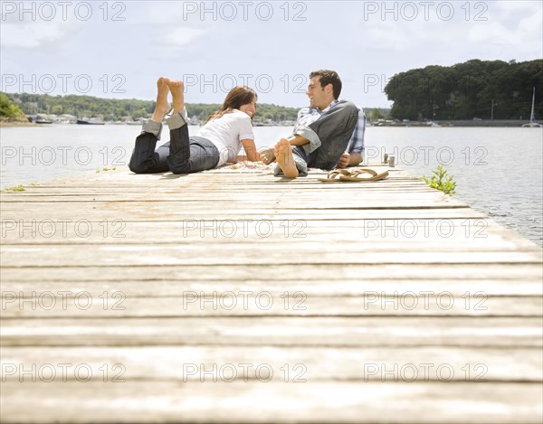 Couple laying on dock. Date : 2008