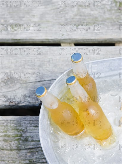 Beer bottles in bucket of ice. Date : 2008