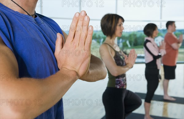 Yoga class in tree pose. Date : 2008