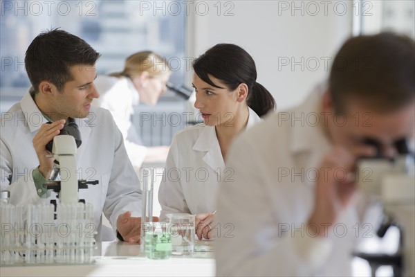 Scientists working in pharmaceutical laboratory.