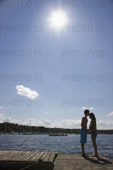 Couple kissing on dock. Date : 2008