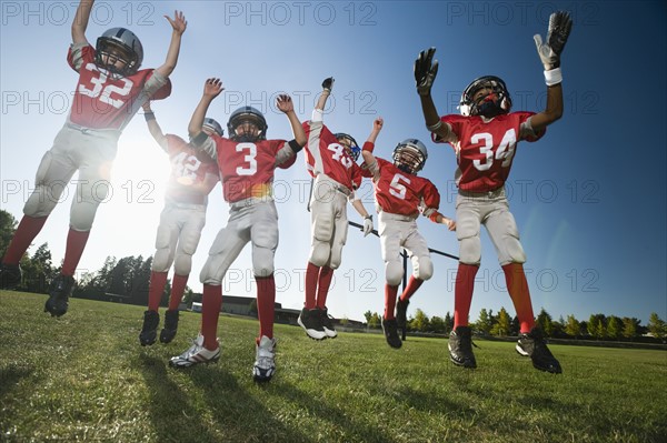 Football players celebrating on field. Date : 2008