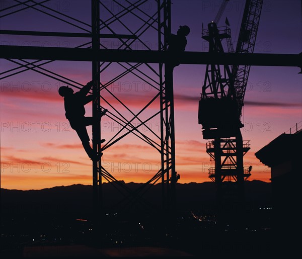 Workers climbing towers of construction site in Las Vegas. Date: 2008