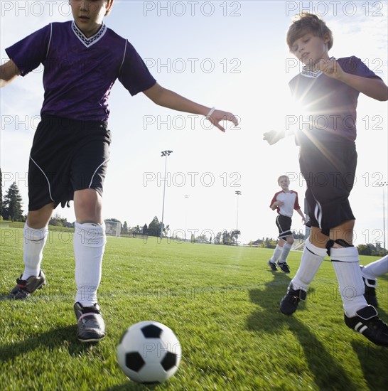 Boys playing competitive soccer. Date : 2008