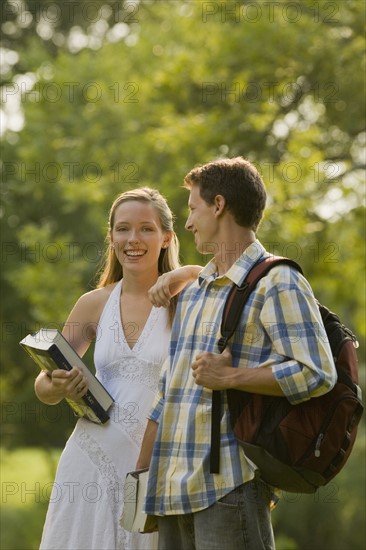 Portrait of college students with books and backpack. Date : 2008