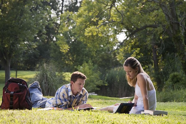 College students studying in grass. Date : 2008