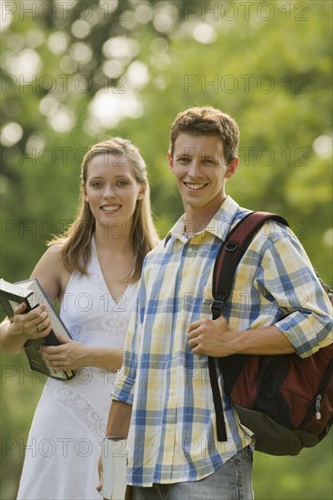 Portrait of college students with books and backpack. Date : 2008