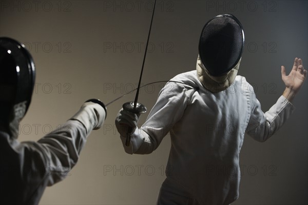 Two men fencing. Date: 2008