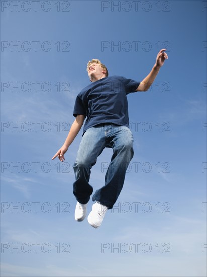 Teenage boy in mid-air. Date: 2008