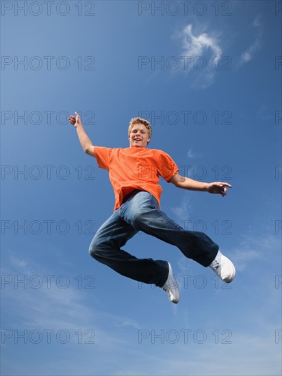 Portrait of teenage boy in mid-air. Date: 2008