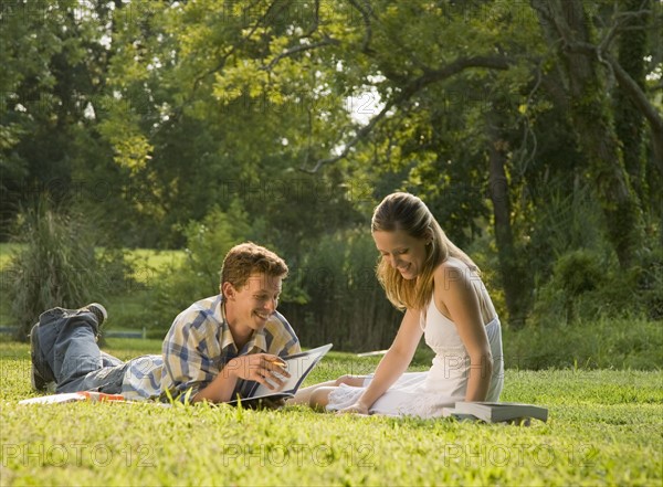 College students studying in grass. Date : 2008