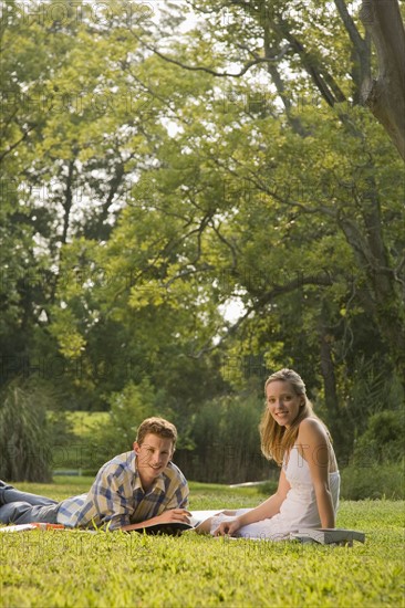 Portrait of college students studying in grass. Date : 2008