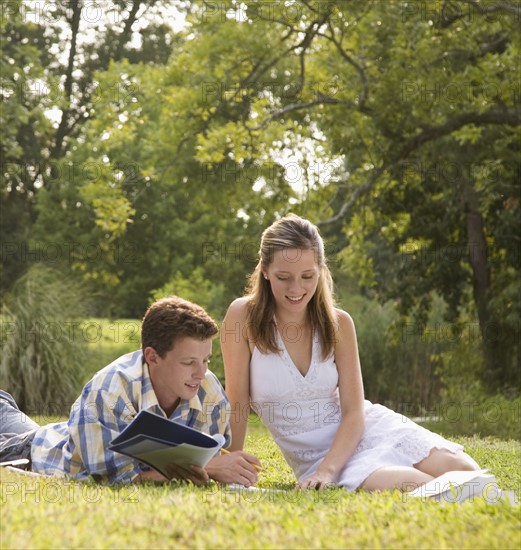 College students studying in grass. Date : 2008