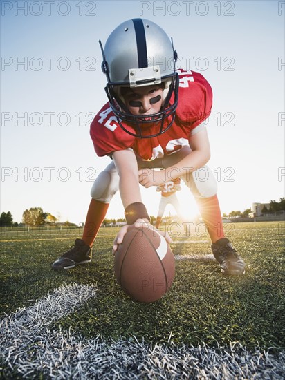 Football center ready to snap football. Date : 2008