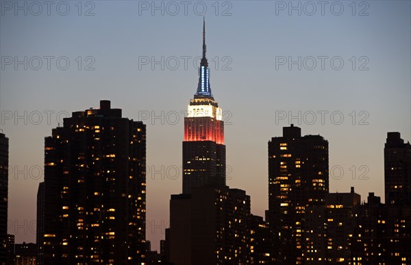 Illuminated Empire State Building at dusk. Date: 2008