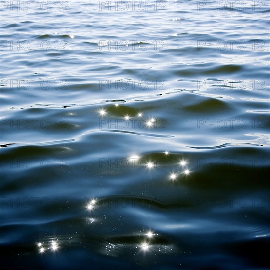 Sun reflecting on lake. Date: 2008