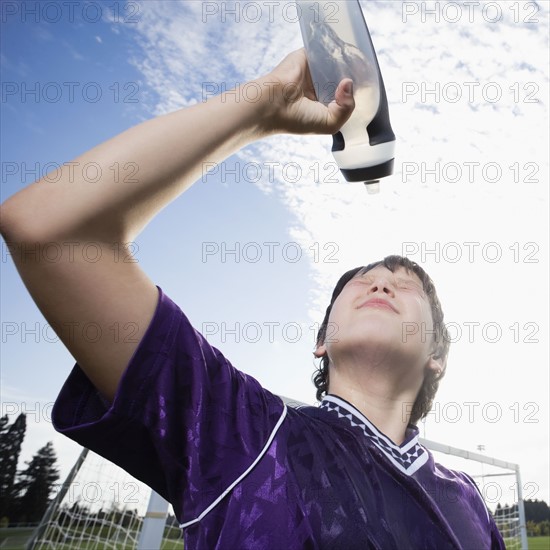 Soccer playing squirting water on face. Date : 2008