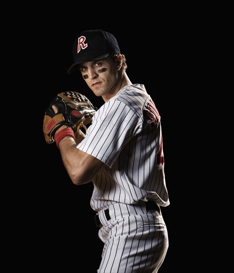 Portrait of pitcher preparing to throw ball. Date : 2008